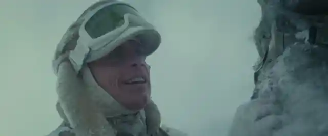 In “The Empire Strikes Back”, how does Luke keep warm during a nasty blizzard on the ice planet Hoth? 